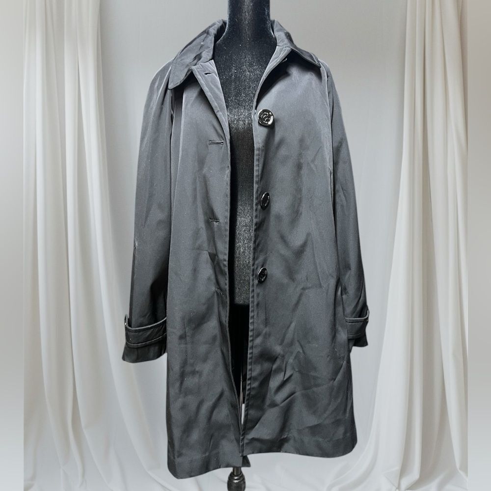 Long black Calvin Klein polyester jacket. Worn a few times. Button down jacket.